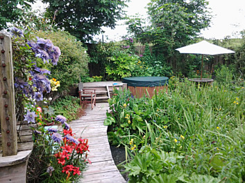 Path leading to the hot tub and  sheltered seating area